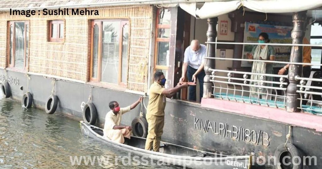 The Special Cover on Indian Coir being carried by a traditional country boat and handed over to postal officials.