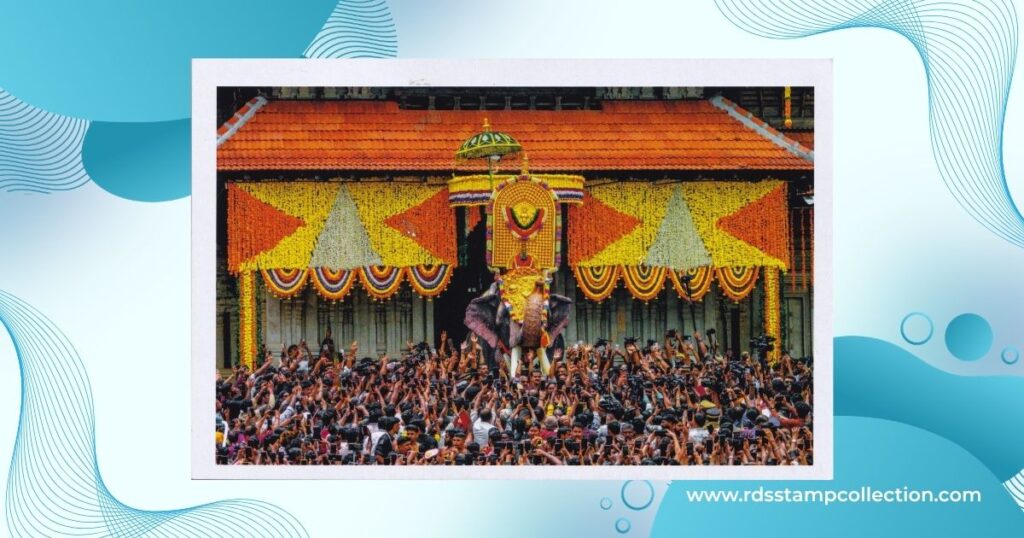 Front side of the Thrissur Pooram Vilambaram picture postcard, showing a decorated elephant before a large festival crowd and floral temple decorations. Photograph by Jithin E Jayanarayanan, issued by Kerala Postal Circle.